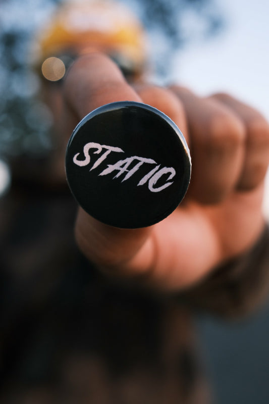 Static pin back button